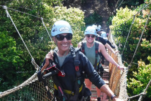 Clolita on rope bridge to zipline in Maui, HI